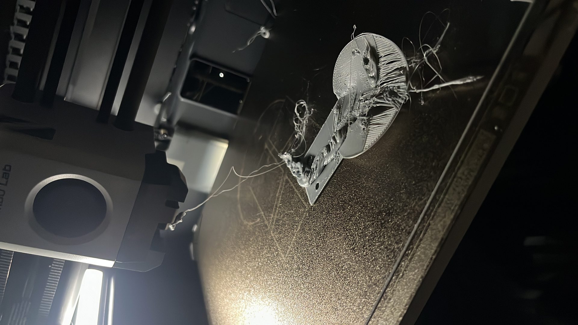 Bambu Lab printing — macro close-up of nozzle and part